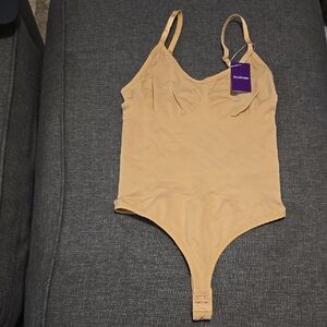 HeyShape Women's Beige Bodysuit with Adjustable Straps Size M.